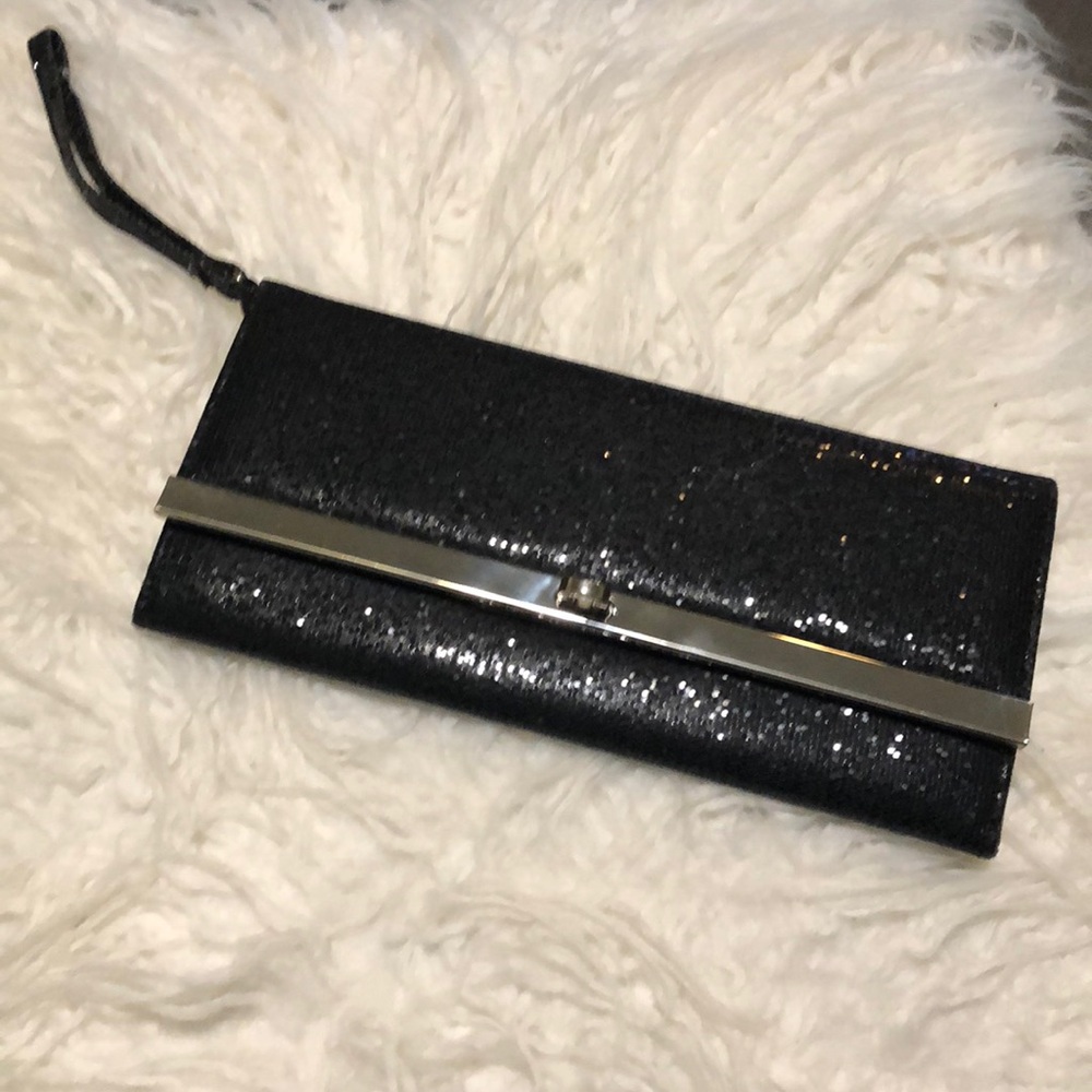 Black clutch party handbag 9x4 inches.